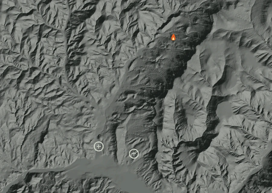 Shaded relief map of the 0445 Crosswhite Fire. Amber flames mark every place that gave off heat in the last day; the shading is the shape of the ground.