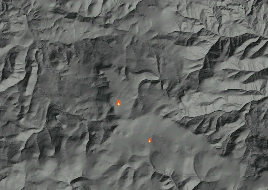 Shaded relief map of the 0468 Fire. Amber flames mark every place that gave off heat in the last day; the shading is the shape of the ground.