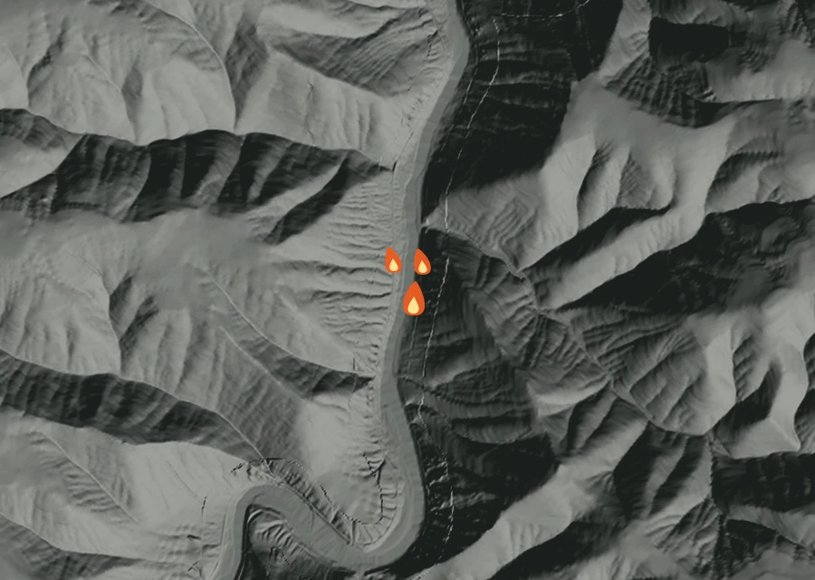Shaded relief map of the 0885 Fire. Amber flames mark every place that gave off heat in the last day; the shading is the shape of the ground.