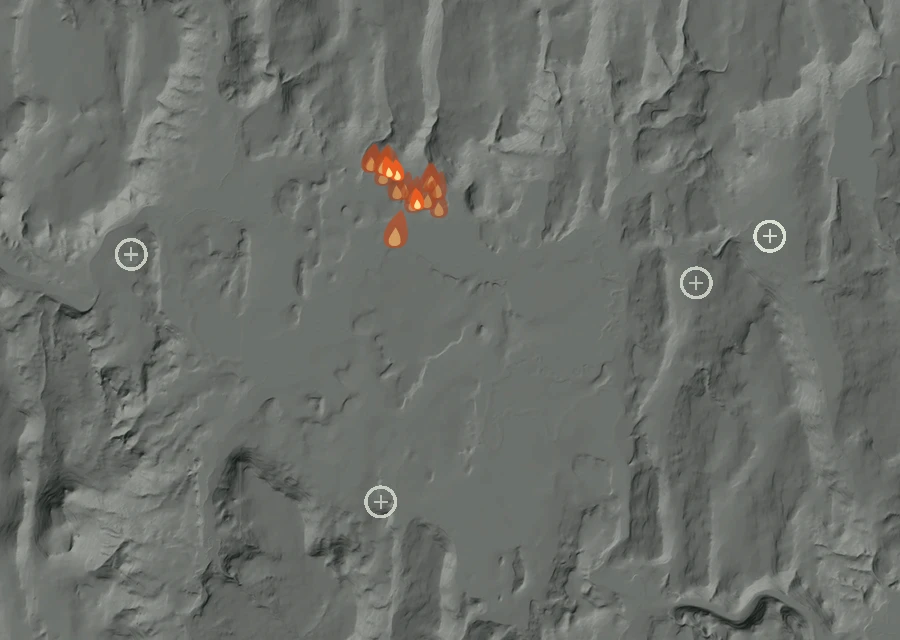 Shaded relief map of the 345 Fire. Amber flames mark every place that gave off heat in the last day; the shading is the shape of the ground.