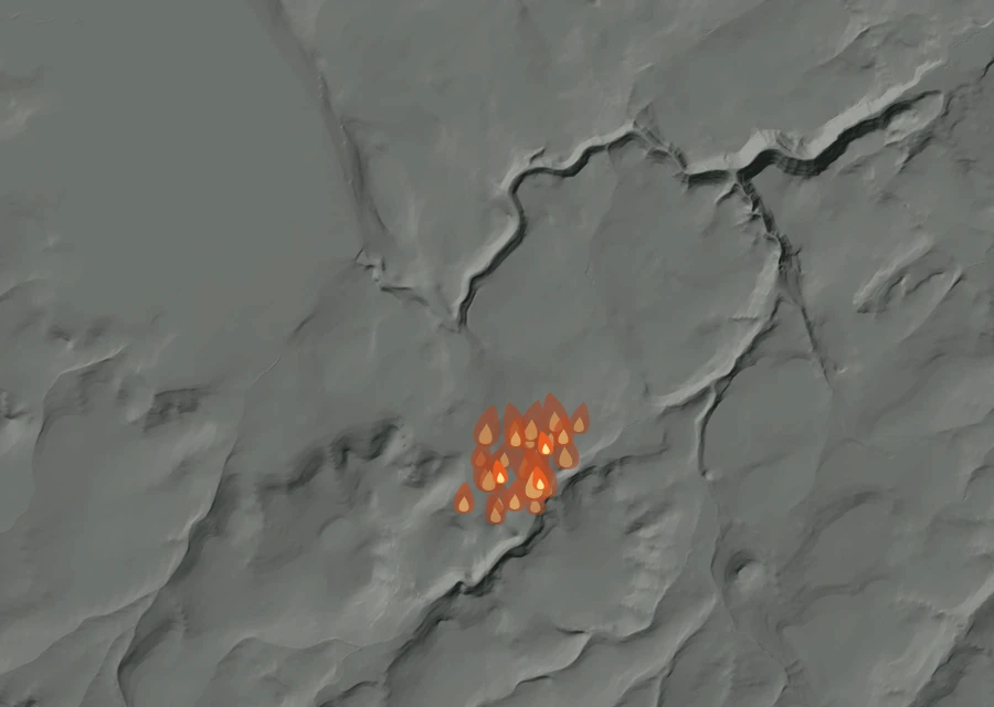 Shaded relief map of the 354 Fire. Amber flames mark every place that gave off heat in the last day; the shading is the shape of the ground.