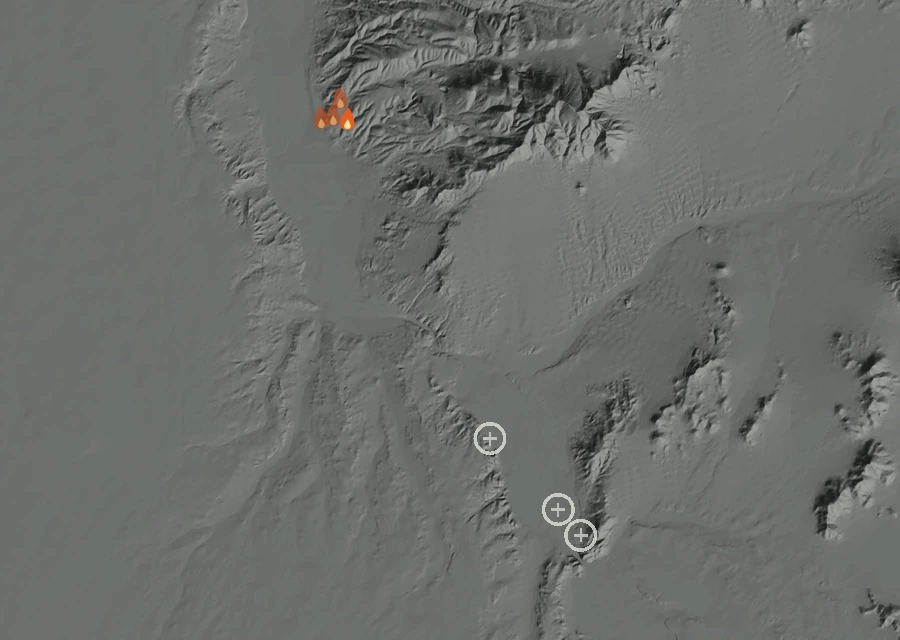 Shaded relief map of the Bell Fire. Amber flames mark every place that gave off heat in the last day; the shading is the shape of the ground.