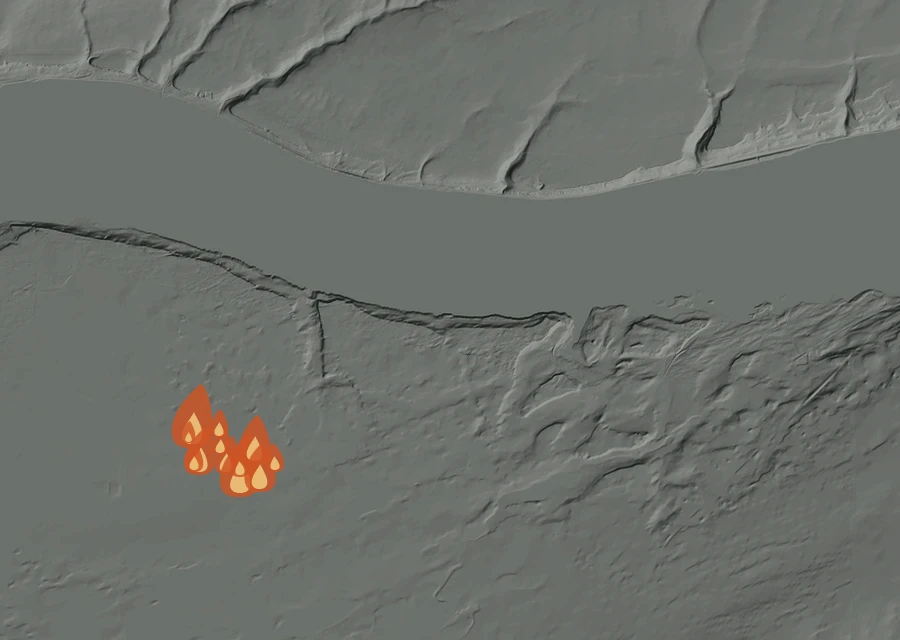 Shaded relief map of the Berrian Fire. Amber flames mark every place that gave off heat in the last day; the shading is the shape of the ground.