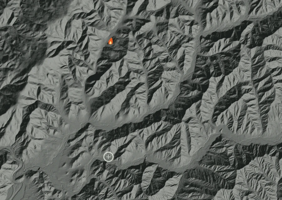 Shaded relief map of the Big Lick Lane Fire. Amber flames mark every place that gave off heat in the last day; the shading is the shape of the ground.