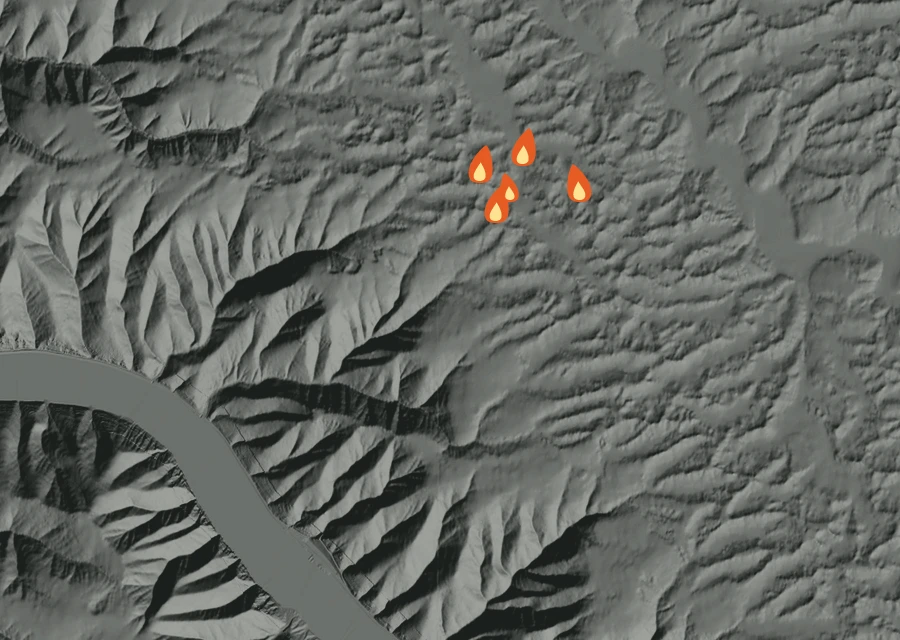 Shaded relief map of the Blyton Landing Fire. Amber flames mark every place that gave off heat in the last day; the shading is the shape of the ground.