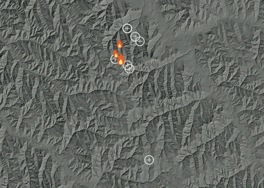 Shaded relief map of the Broken Jaw Fire. Amber flames mark every place that gave off heat in the last day; the shading is the shape of the ground.