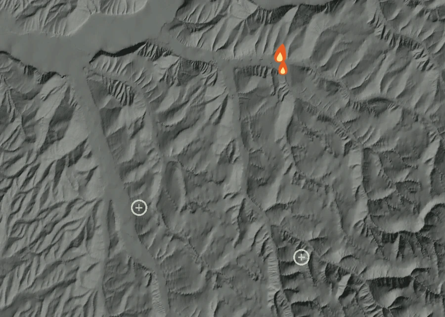 Shaded relief map of the Bundy Hollow 1498 Request Fire. Amber flames mark every place that gave off heat in the last day; the shading is the shape of the ground.