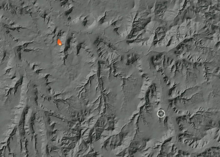 Shaded relief map of the Campbell Divide Fire. Amber flames mark every place that gave off heat in the last day; the shading is the shape of the ground.