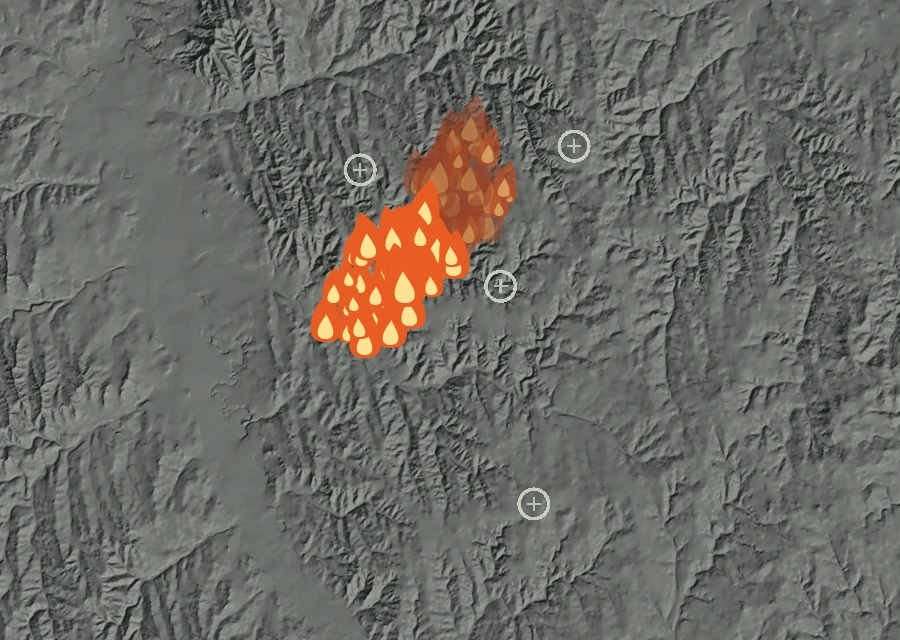 Shaded relief map of the Candle Fire. Amber flames mark every place that gave off heat in the last day; the shading is the shape of the ground.