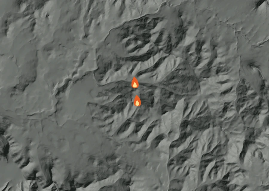 Shaded relief map of the Case Hill Fire. Amber flames mark every place that gave off heat in the last day; the shading is the shape of the ground.