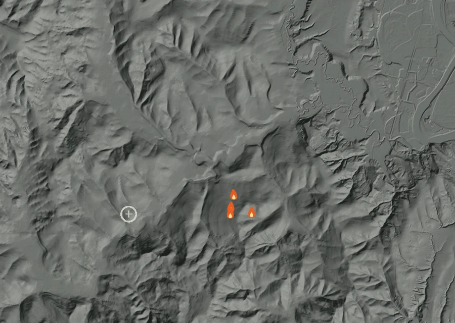 Shaded relief map of the Cline Fire. Amber flames mark every place that gave off heat in the last day; the shading is the shape of the ground.