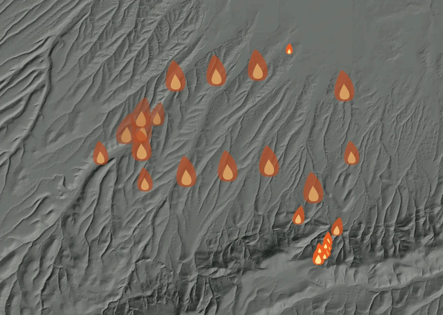 Shaded relief map of the Colwash Fire. Amber flames mark every place that gave off heat in the last day; the shading is the shape of the ground.