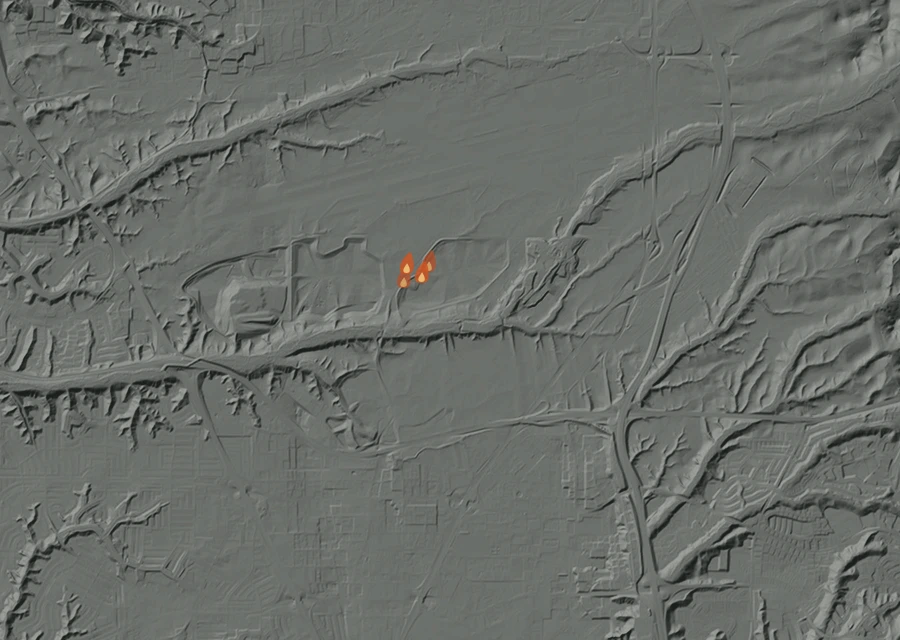 Shaded relief map of the Convoy Fire. Amber flames mark every place that gave off heat in the last day; the shading is the shape of the ground.