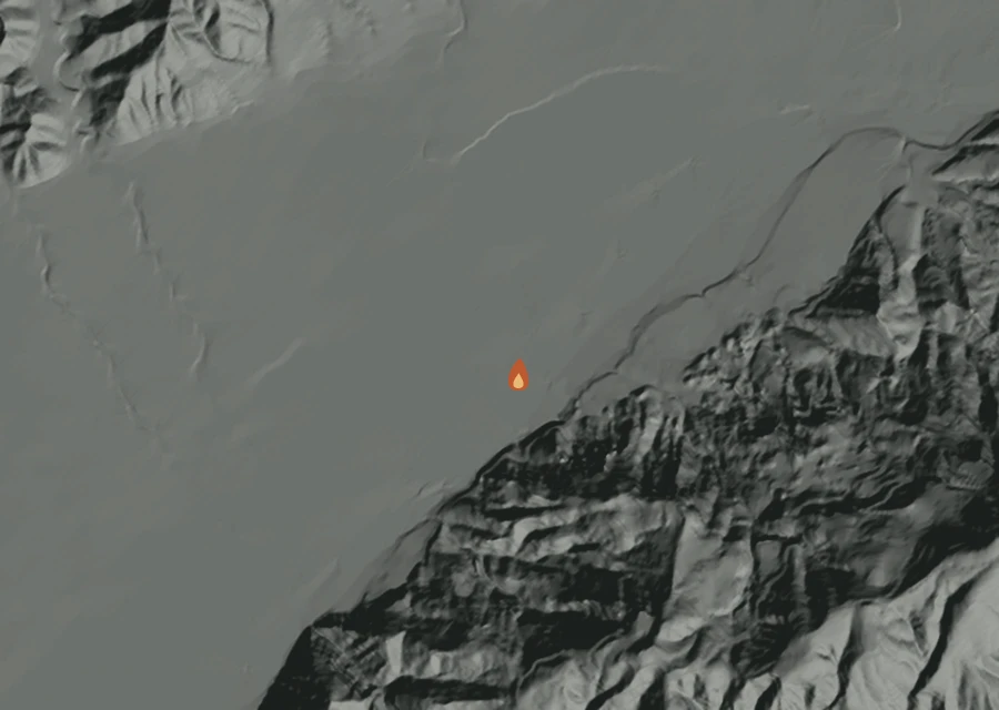 Shaded relief map of the Cornell Fire. Amber flames mark every place that gave off heat in the last day; the shading is the shape of the ground.