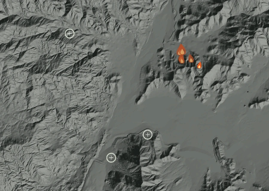 Shaded relief map of the Cyrus Fire. Amber flames mark every place that gave off heat in the last day; the shading is the shape of the ground.