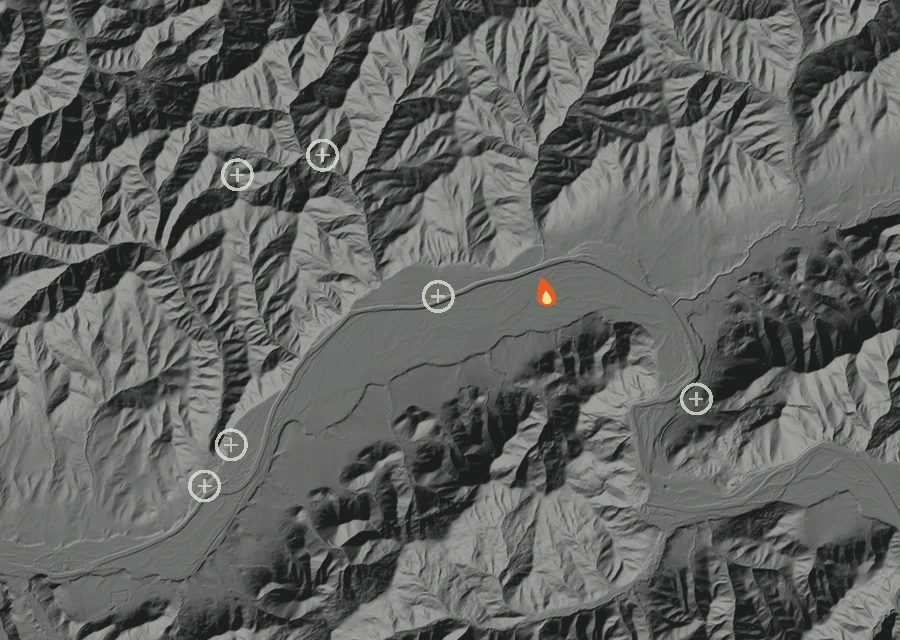 Shaded relief map of the Days Creek Bridge Fire. Amber flames mark every place that gave off heat in the last day; the shading is the shape of the ground.