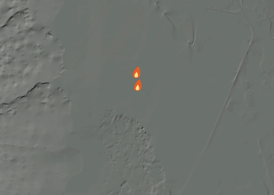 Shaded relief map of the Division Fire. Amber flames mark every place that gave off heat in the last day; the shading is the shape of the ground.