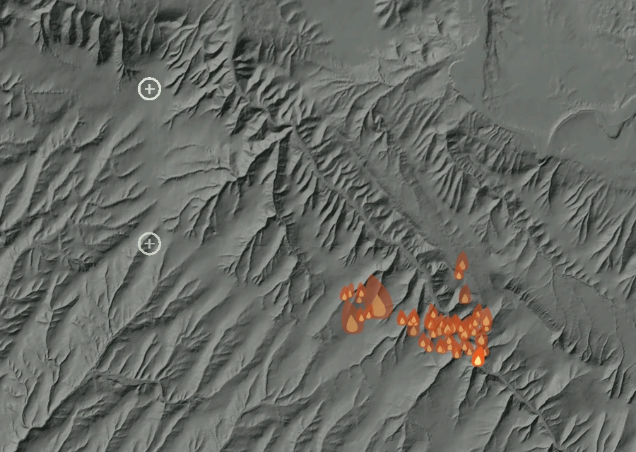 Shaded relief map of the Dorran Road Fire. Amber flames mark every place that gave off heat in the last day; the shading is the shape of the ground.