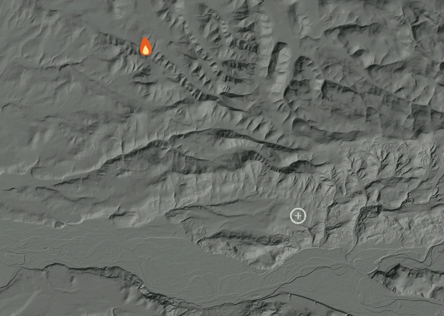 Shaded relief map of the Etzel Road Fire. Amber flames mark every place that gave off heat in the last day; the shading is the shape of the ground.