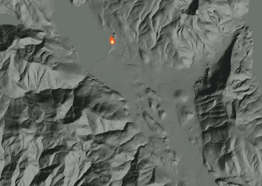 Shaded relief map of the Five Four Fire. Amber flames mark every place that gave off heat in the last day; the shading is the shape of the ground.