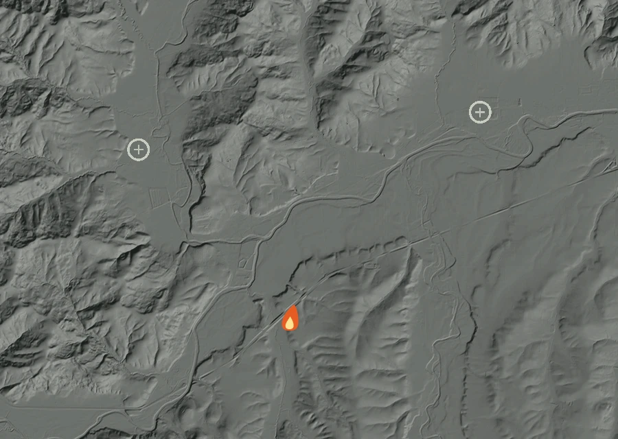 Shaded relief map of the Fort Hill Fire. Amber flames mark every place that gave off heat in the last day; the shading is the shape of the ground.