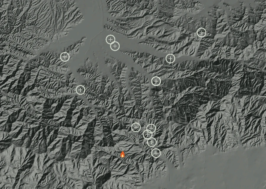 Shaded relief map of the Freeway Fire. Amber flames mark every place that gave off heat in the last day; the shading is the shape of the ground.