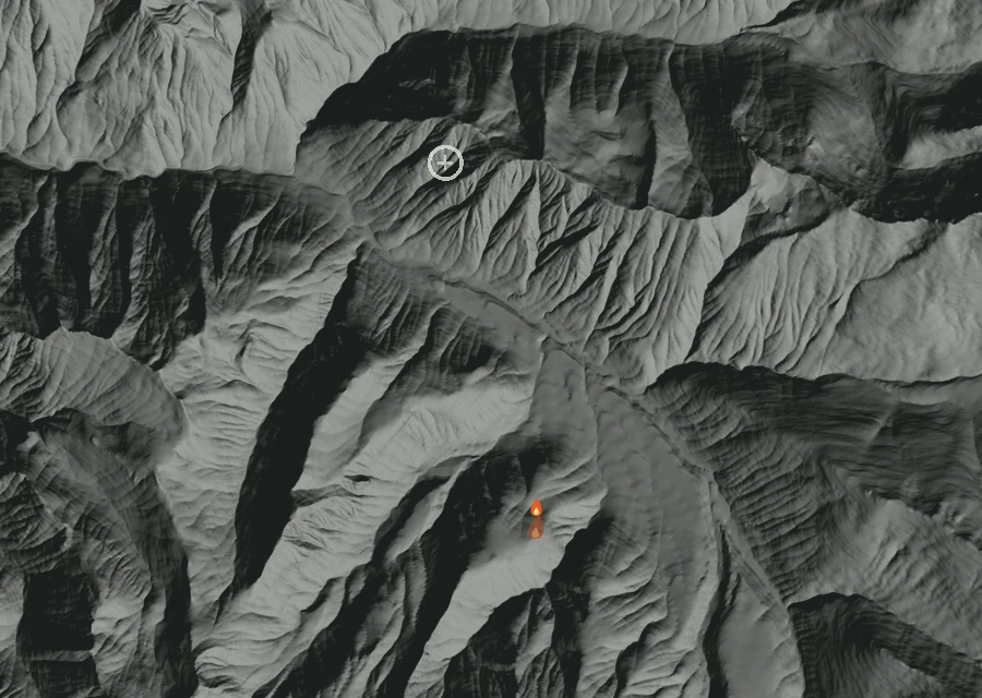 Shaded relief map of the Gamma Creek Fire. Amber flames mark every place that gave off heat in the last day; the shading is the shape of the ground.