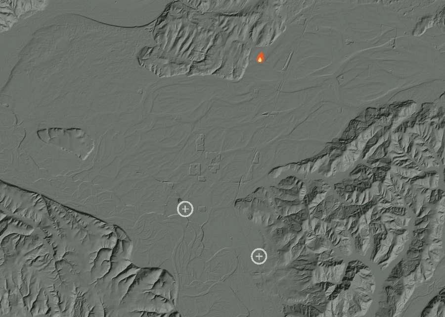 Shaded relief map of the Grand Mound Peak Fire. Amber flames mark every place that gave off heat in the last day; the shading is the shape of the ground.