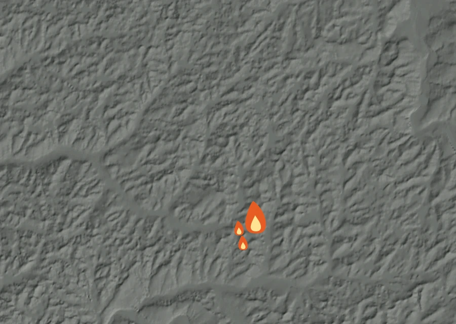 Shaded relief map of the Griffith Fire. Amber flames mark every place that gave off heat in the last day; the shading is the shape of the ground.