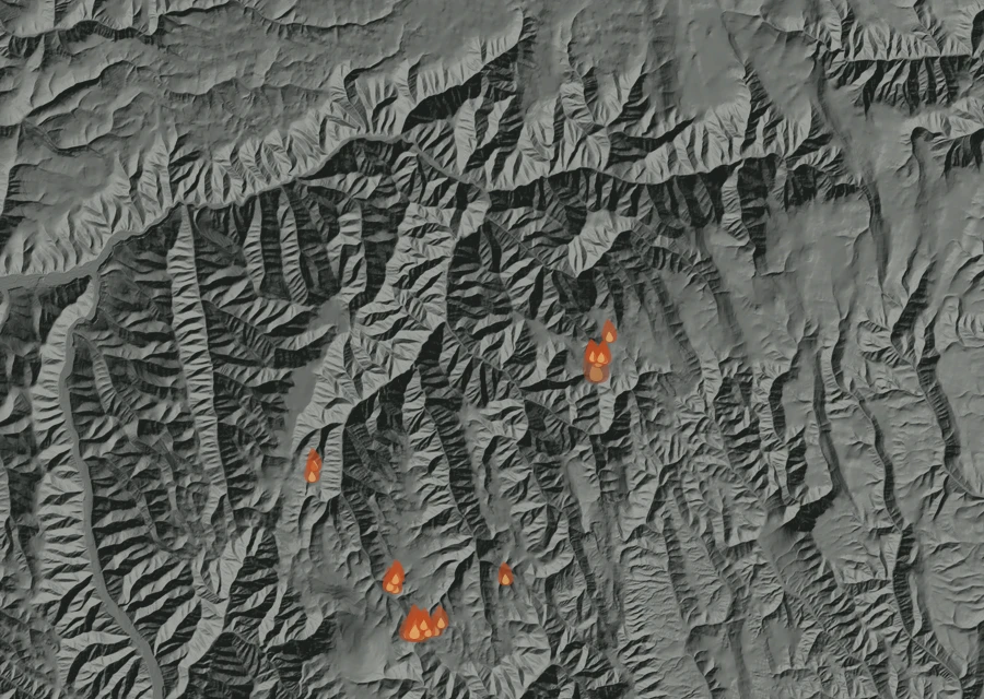 Shaded relief map of the Hagen Fire. Amber flames mark every place that gave off heat in the last day; the shading is the shape of the ground.