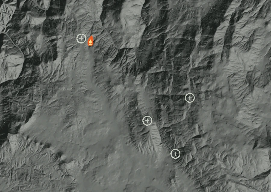 Shaded relief map of the Horse Fire. Amber flames mark every place that gave off heat in the last day; the shading is the shape of the ground.