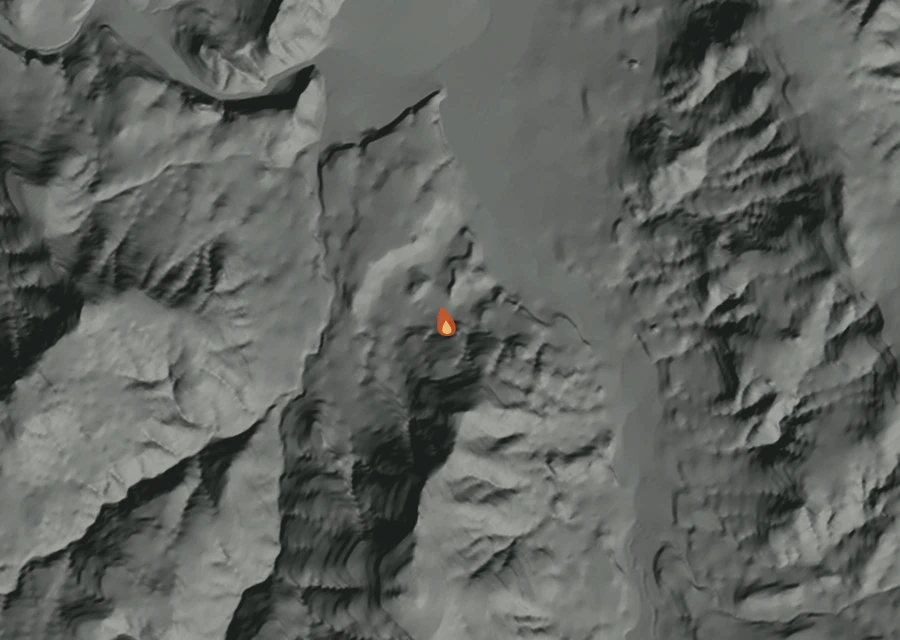 Shaded relief map of the Jack Of Clubs Fire. Amber flames mark every place that gave off heat in the last day; the shading is the shape of the ground.