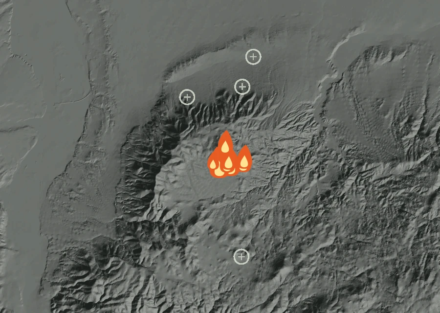 Shaded relief map of the Juniper Fire. Amber flames mark every place that gave off heat in the last day; the shading is the shape of the ground.