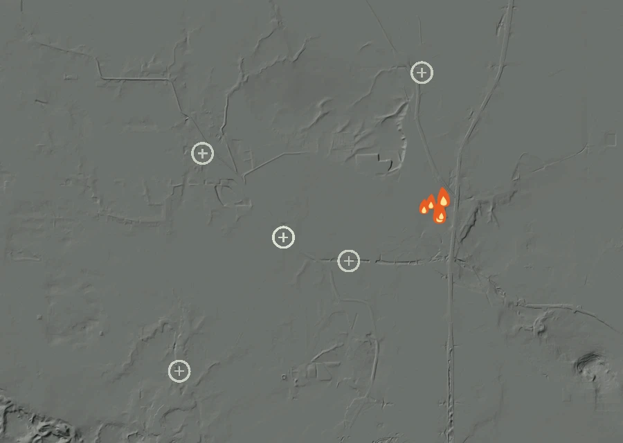Shaded relief map of the Lac-299374 Fire. Amber flames mark every place that gave off heat in the last day; the shading is the shape of the ground.