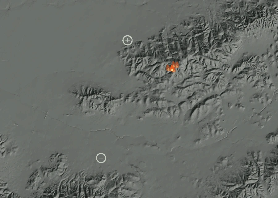 Shaded relief map of the Lac-299590 Fire. Amber flames mark every place that gave off heat in the last day; the shading is the shape of the ground.
