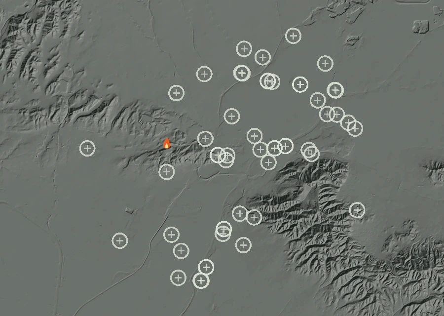 Shaded relief map of the Lac-302757 Fire. Amber flames mark every place that gave off heat in the last day; the shading is the shape of the ground.