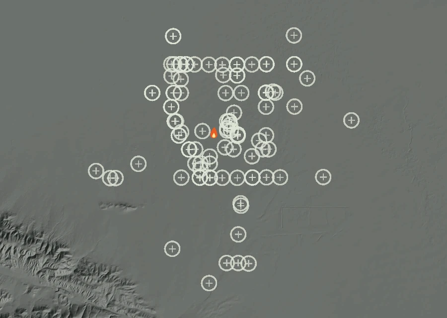 Shaded relief map of the Lac-311844 Fire. Amber flames mark every place that gave off heat in the last day; the shading is the shape of the ground.