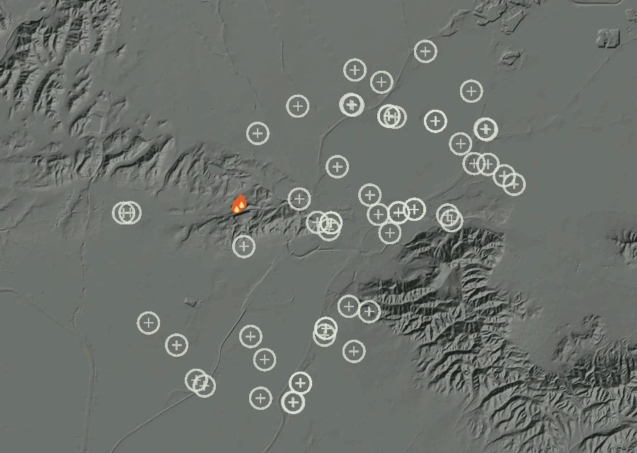 Shaded relief map of the Lac-325444 Fire. Amber flames mark every place that gave off heat in the last day; the shading is the shape of the ground.