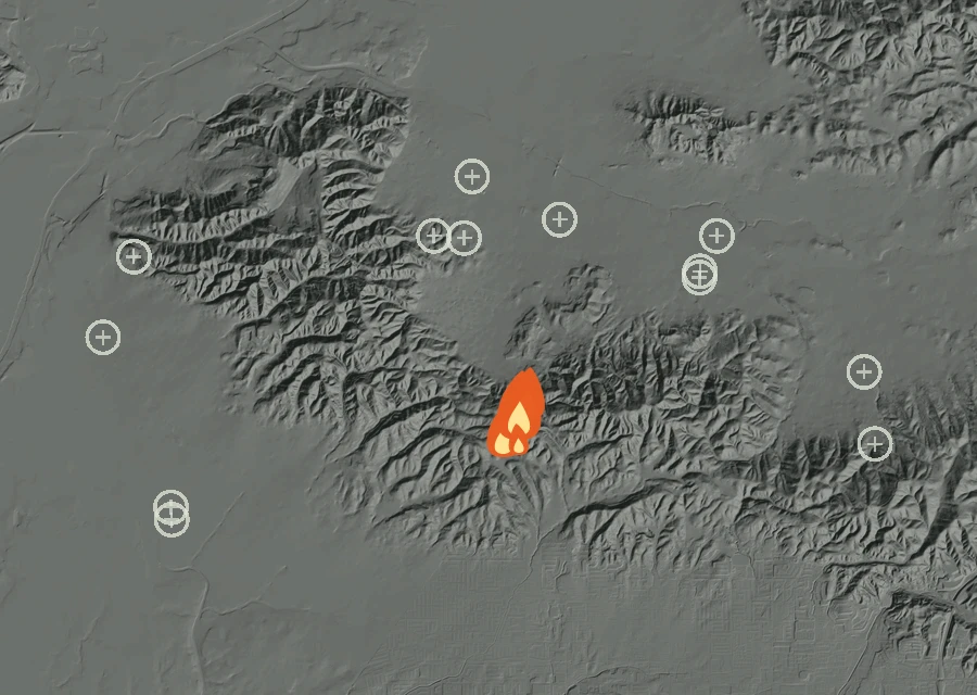 Shaded relief map of the Lac-331488 Fire. Amber flames mark every place that gave off heat in the last day; the shading is the shape of the ground.