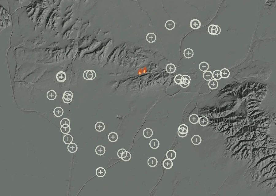 Shaded relief map of the Lac-332672 Fire. Amber flames mark every place that gave off heat in the last day; the shading is the shape of the ground.