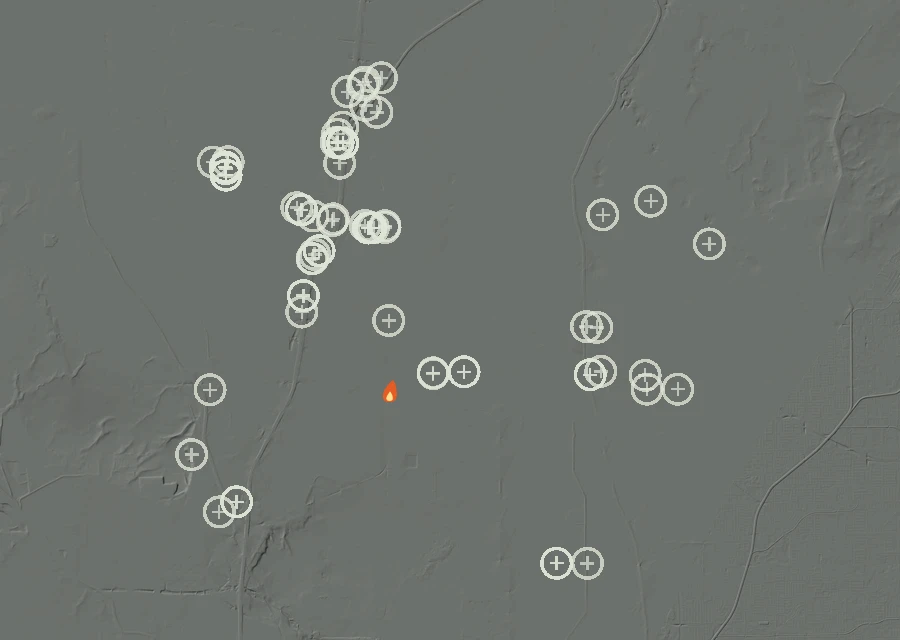Shaded relief map of the Lac-332861 Fire. Amber flames mark every place that gave off heat in the last day; the shading is the shape of the ground.