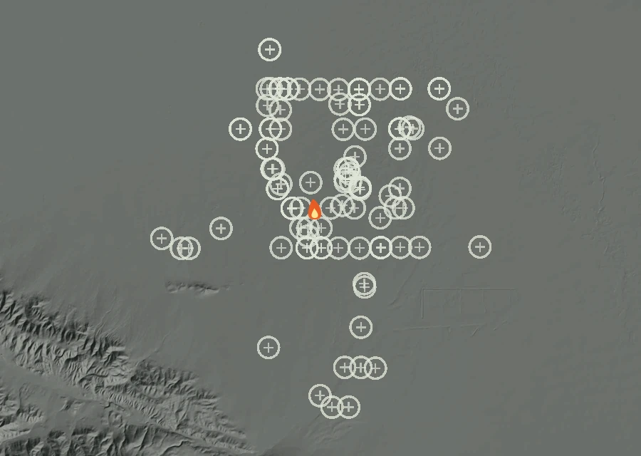 Shaded relief map of the Lac-335523 Fire. Amber flames mark every place that gave off heat in the last day; the shading is the shape of the ground.