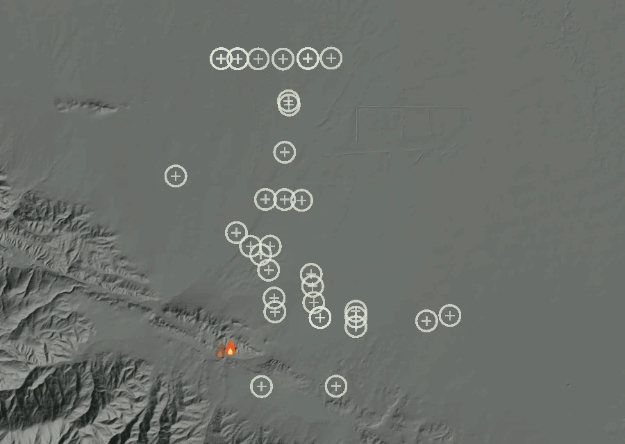 Shaded relief map of the Lac-336513 Fire. Amber flames mark every place that gave off heat in the last day; the shading is the shape of the ground.