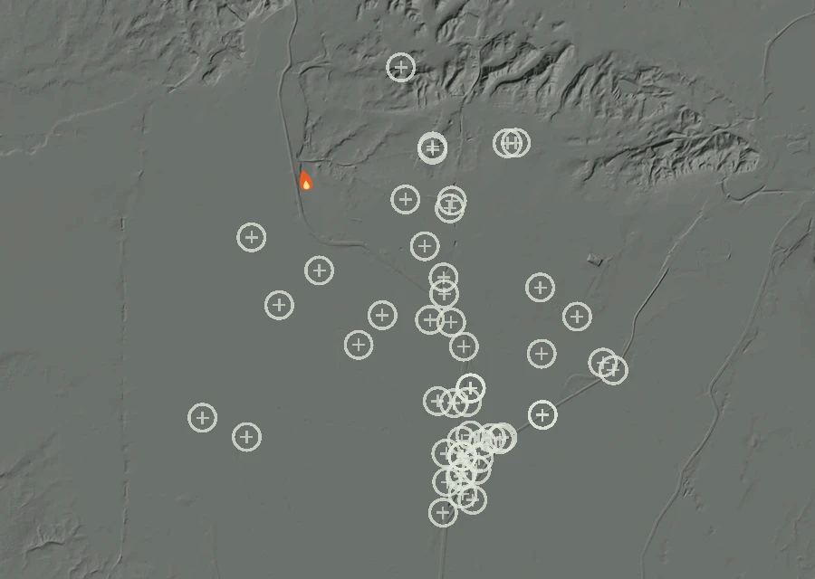 Shaded relief map of the Lac-339781 Fire. Amber flames mark every place that gave off heat in the last day; the shading is the shape of the ground.