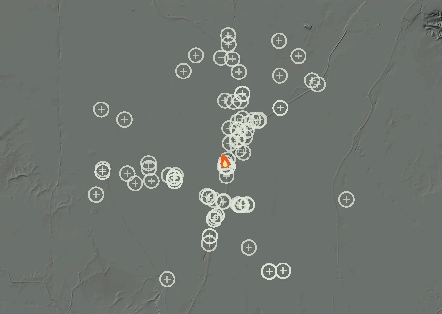 Shaded relief map of the Lac-357641 Fire. Amber flames mark every place that gave off heat in the last day; the shading is the shape of the ground.