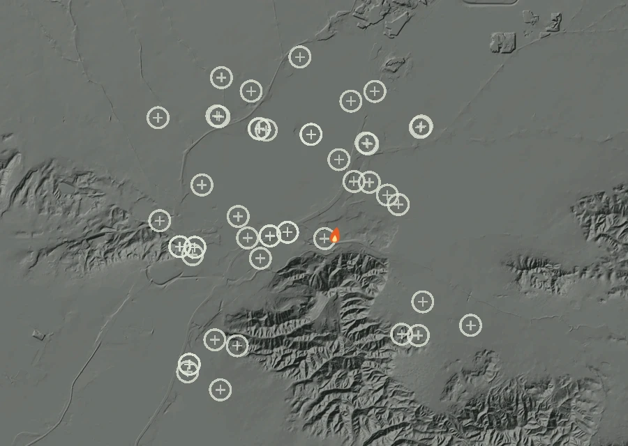 Shaded relief map of the Lac-363766 Fire. Amber flames mark every place that gave off heat in the last day; the shading is the shape of the ground.