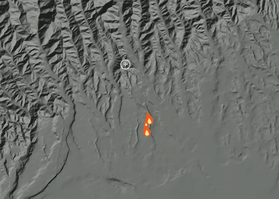 Shaded relief map of the Lac-370878 Fire. Amber flames mark every place that gave off heat in the last day; the shading is the shape of the ground.