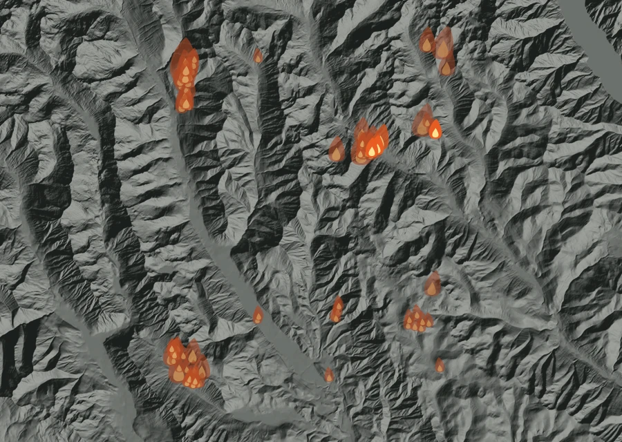 Shaded relief map of the Little Giant Fire. Amber flames mark every place that gave off heat in the last day; the shading is the shape of the ground.