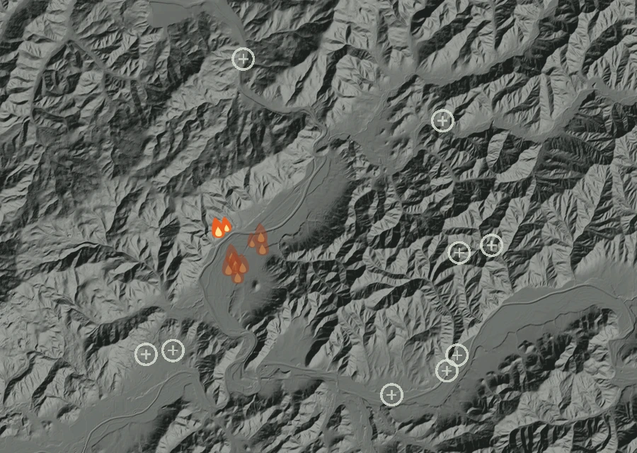 Shaded relief map of the Loop Rd. Fire. Amber flames mark every place that gave off heat in the last day; the shading is the shape of the ground.