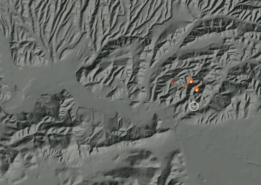 Shaded relief map of the Madera Inc Fire. Amber flames mark every place that gave off heat in the last day; the shading is the shape of the ground.